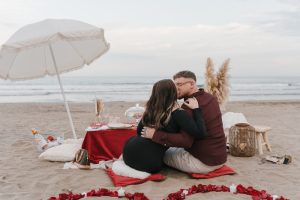 marriage proposal with picnic in the beach petals Natalia Ortiz